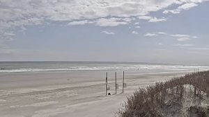 Live view of Sunset Beach, NC via webcam – Watch real-time beach conditions, ocean waves, and stunning coastal sunsets.