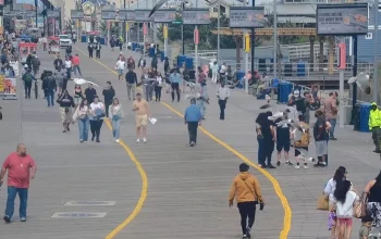 Atlantic City Cams showing live views along the boardwalk with people walking, beachgoers, casinos, and ocean scenery in Atlantic City, New Jersey.
