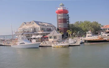 Live cam view of The Sea Pines Resort in Hilton Head, SC showcasing scenic coastal landscape lush and oceanfront activity.