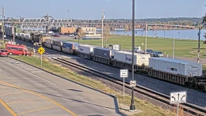 Fort Madison Iowa Webcam capturing downtown traffic, pedestrians, and passing locomotives