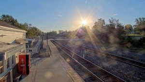 Sunrise over railroad tracks in La Plata, Missouri with warm golden light