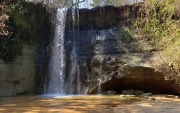 Secluded private waterfall in rural Haleburg, Alabama, located within Henry County countryside, a peaceful nature spot ideal for photography and relaxation